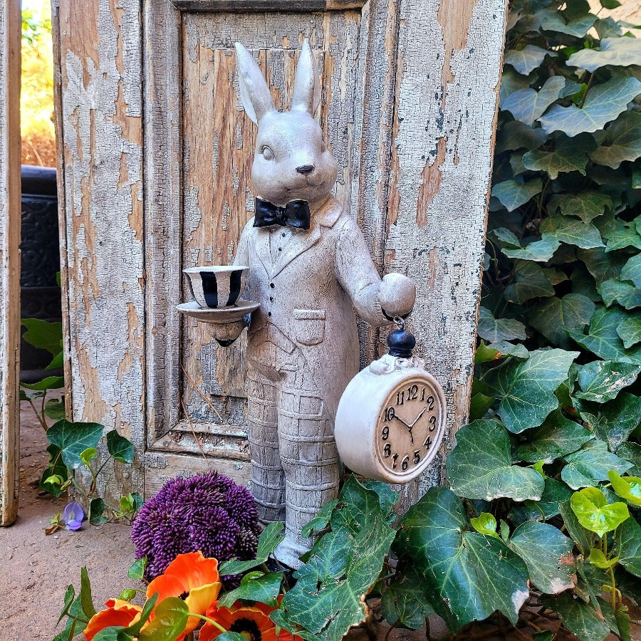 Gray and Black Bunny Holding Clock